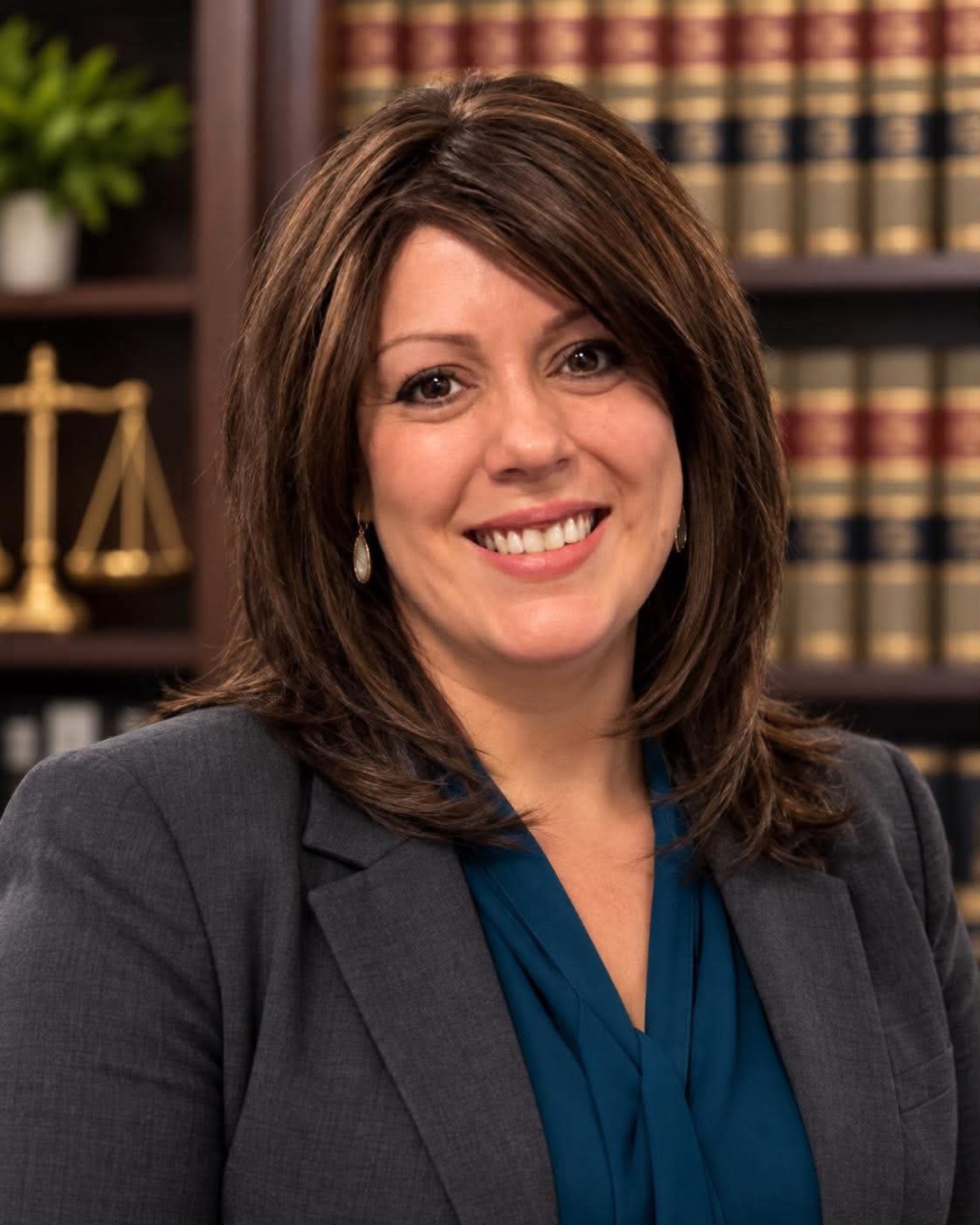 Melissa Johnson, founder of Case by Case Legal Support, in a professional office with law books